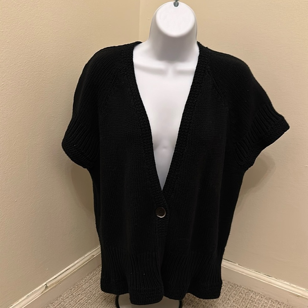 Darling cardigan sweater with one button the middle.  Good condition.